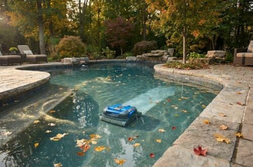 An automatic pool cleaner helping manage light seasonal debris in a residential backyard pool